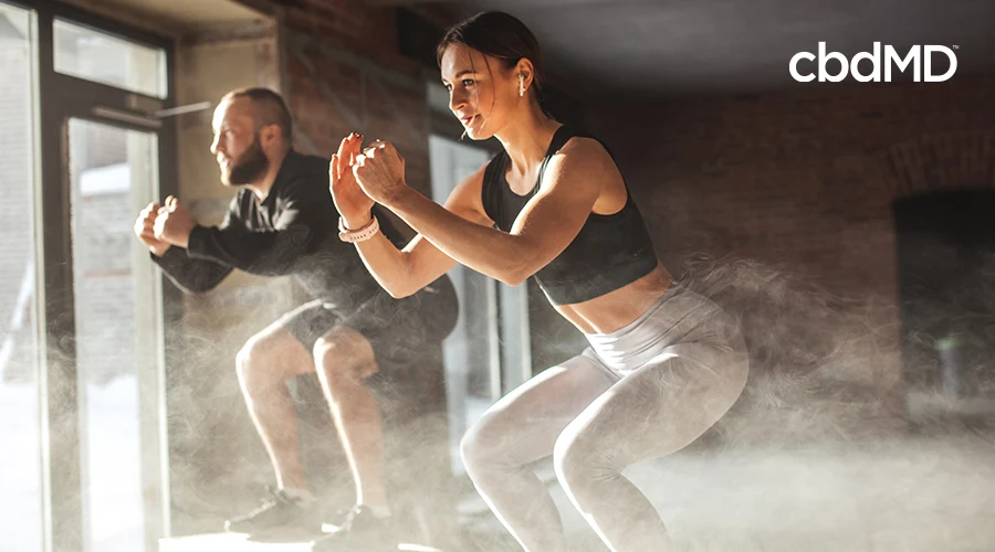 two athletes performing crossfit exercises