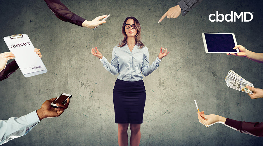 A woman with her eyes closed with multiple arms reaching out to her with different tasks for her to do