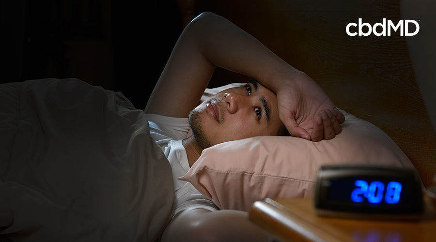 person having a hard time sleeping at two o'clock in the morning