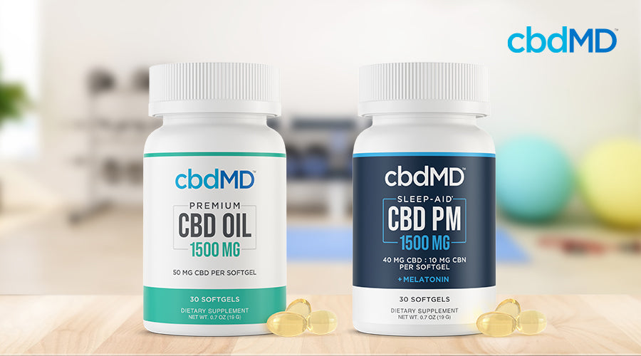 cbdMD cbd oil 1500 mg softgels and sleep aid cbd pm 1500 mg melatonin softgels containers next to each other in an exercise room  