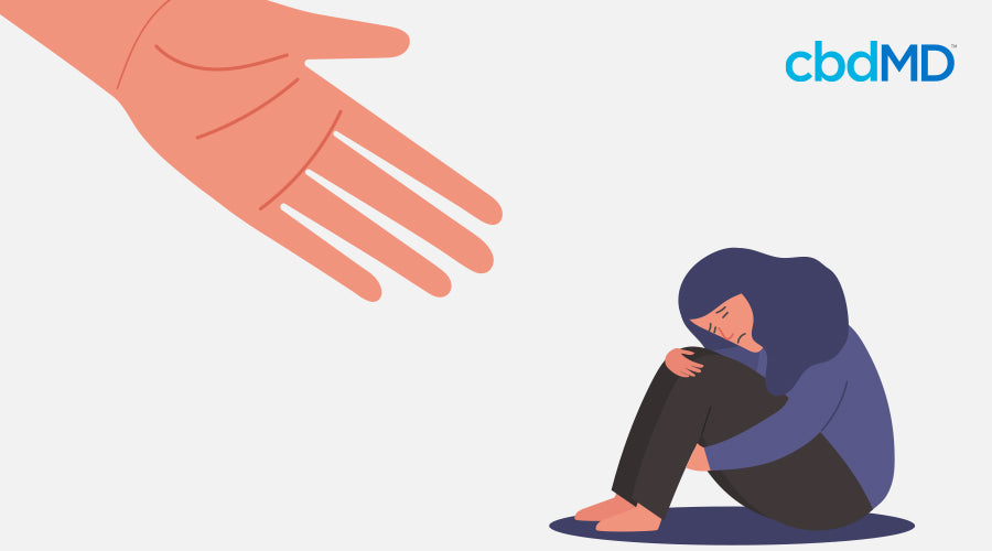 A woman sitting down that is sad with a hand reaching out to her