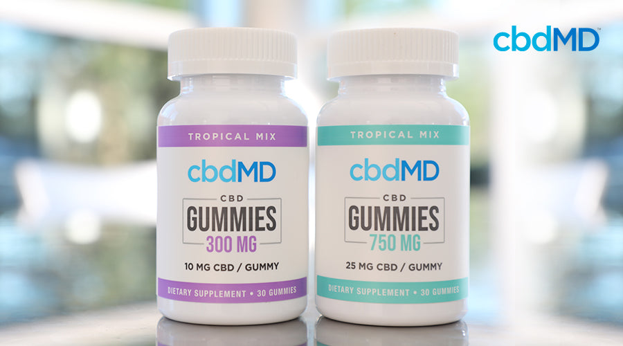 Two tropical cbdMD gummy bottles.