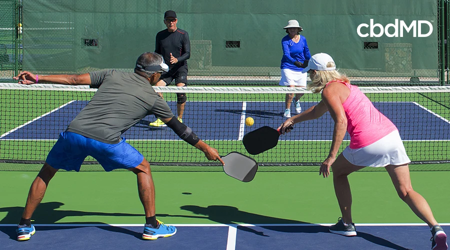 Couples playing Tennis