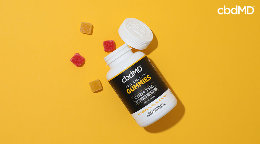 Full spectrum gummies 200 mg cbd 4 mg thc tropical twist with gummies pouring out of the top - cbdMD