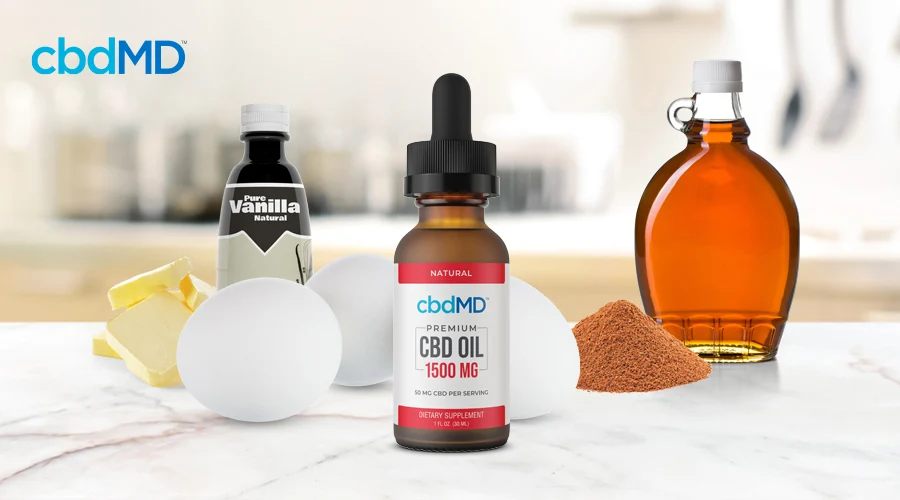 A bottle of 1500 mg cbd oil tincture from cbdmd sits among french toast ingredients