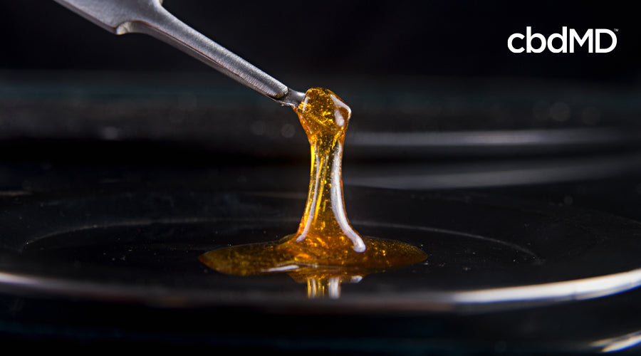 A small tool pulls up a thick strand of cbd oil