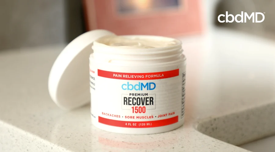 A tub of 1500 mg CBD Recover sits on a bathroom countertop