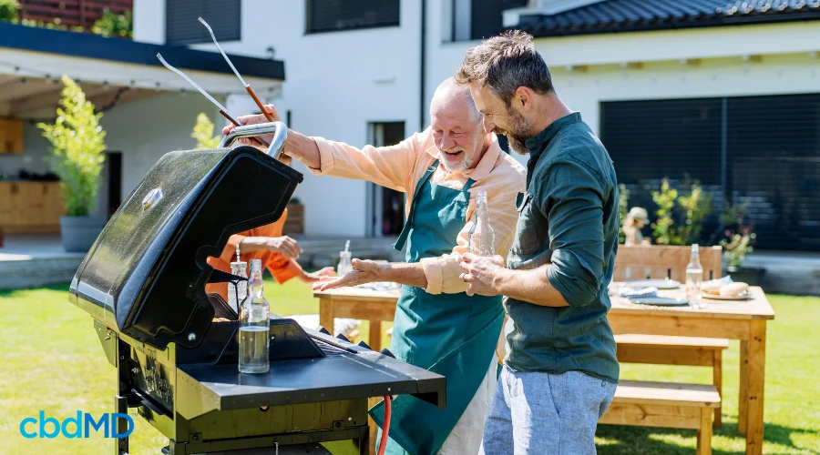 Father and Son Enjoying New Grill as Father’s Day Gift