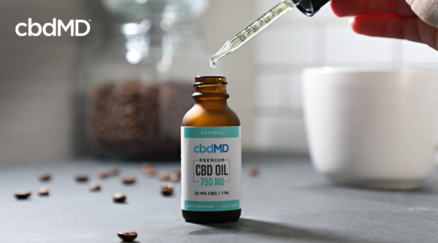 A bottle of 750 mg cbd oil tincture from cbdmd sits on a counter