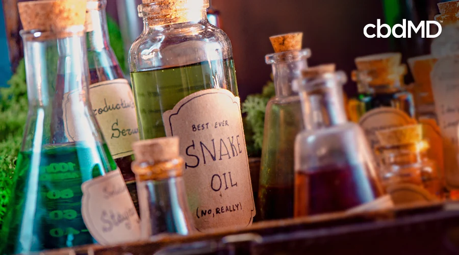 Assorted bottles with various labels sit on a shelf