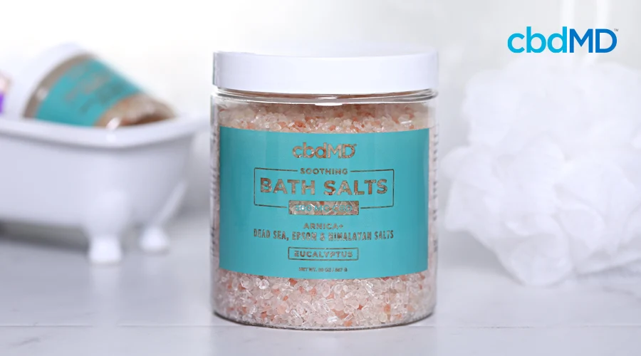 cbdmd bath salts sits among other bath products in a bath room