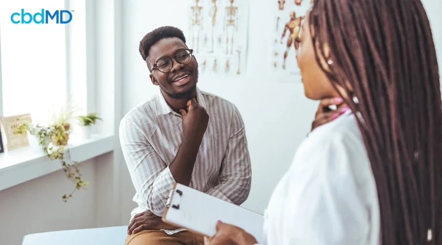 Man Discussing Natural Pain Relief Alternatives with Doctor