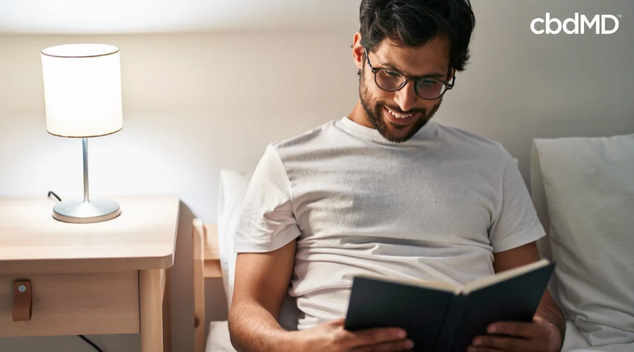 Man Relaxing in Bed After Taking CBD Sleep Aid