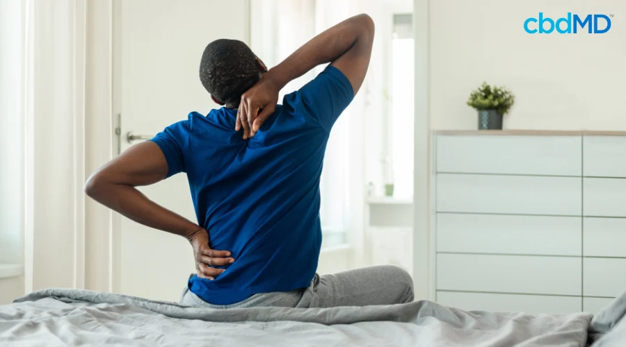 Man Stretching Sore Back and Shoulders