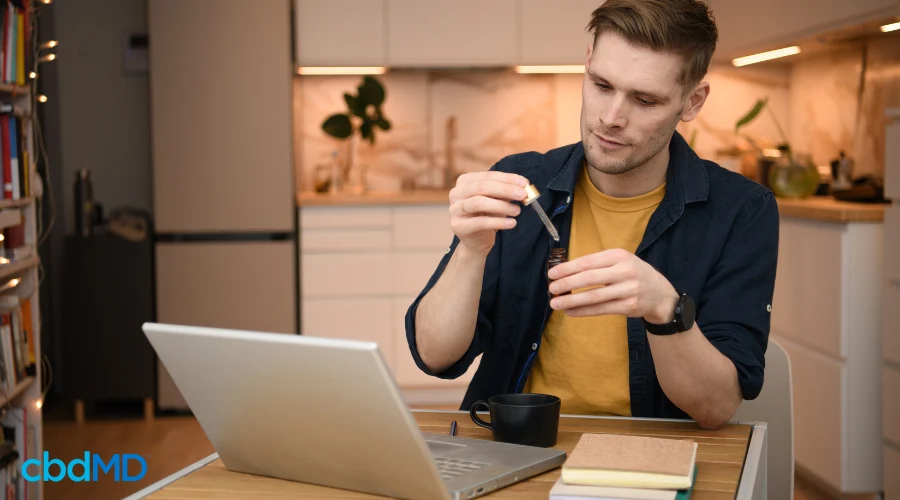 Man Using Calm CBD Tincture for Relaxation