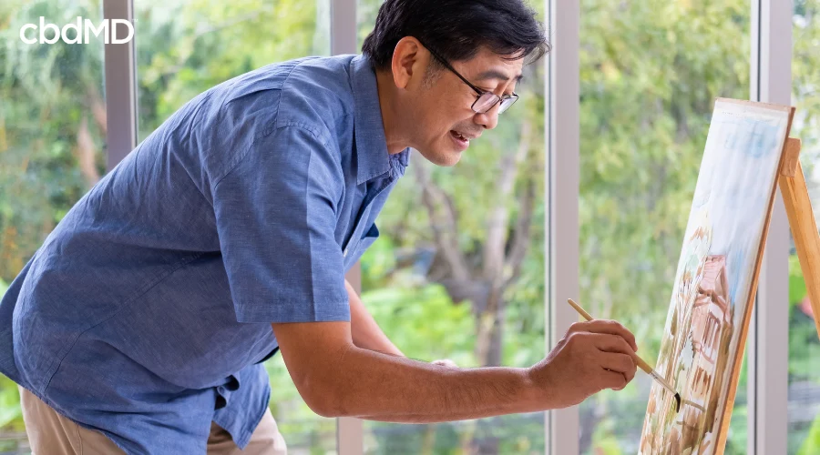 Man Using Painting as Creative Outlet for Better Mental Health