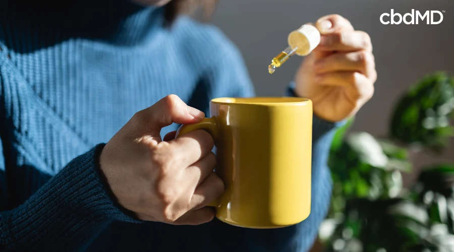 Person Adding CBN Tincture to Tea for Relaxation