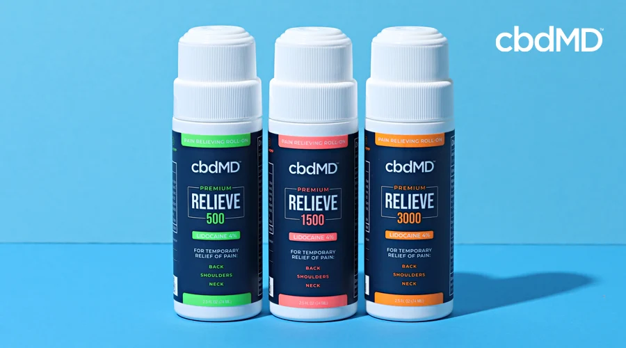 Three roll on tubes of cbd relieve sit in a row against a blue background