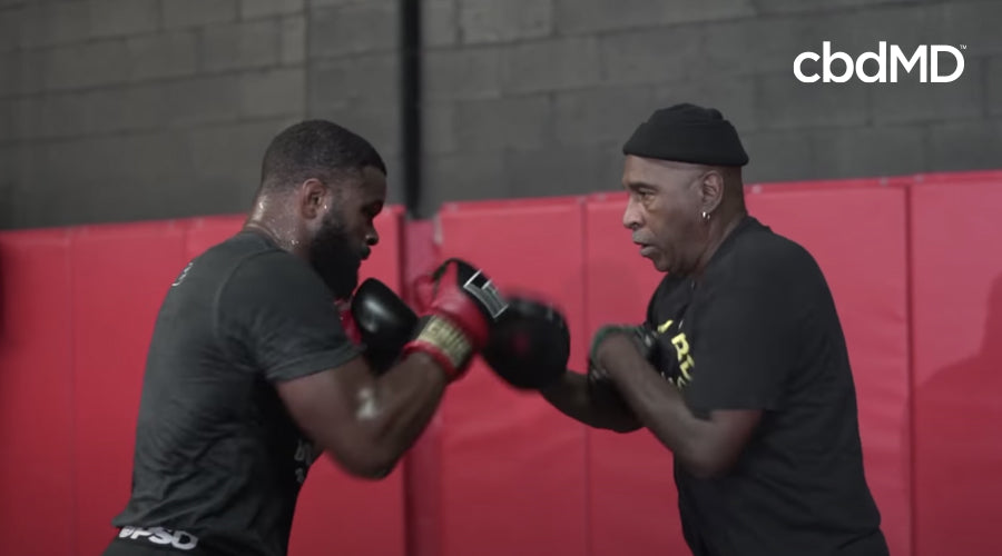 Tyron woodley trains with his trainer in preparation for ufc 178