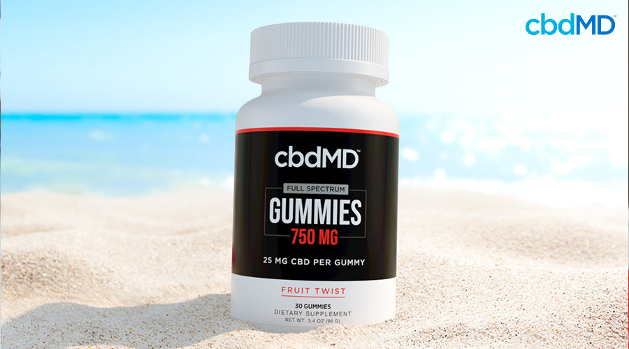 Full spectrum gummies 750 mg fruit twist sitting in the sand at a beach - cbdMD
