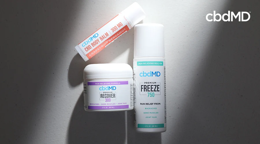 cbd freeze, cbd recover, and cbd body balm sit together against a dark grey background