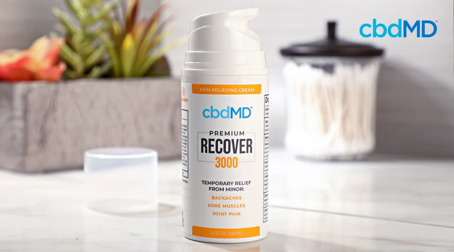 A pump bottle of 3000 mg cbd recover from cbdmd sits on a bathroom counter