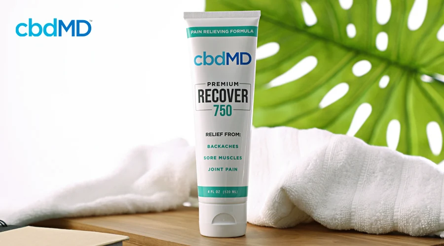 A tube of 750 mg cbd recover from cbdmd sits on a spa countertop