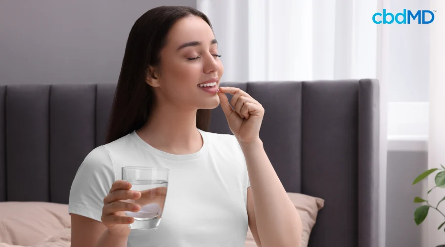 Woman Taking CBD Pill to Help With Better Mental Health