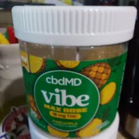 Customer-uploaded image. Click to see more details. The image represents: A white plastic container with a green label featuring pineapple graphics and the text "cbdMD vibe"