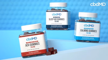Three jars of CBD gummies labeled Sleep-Aid, Calming, and ACV on a blue background.
