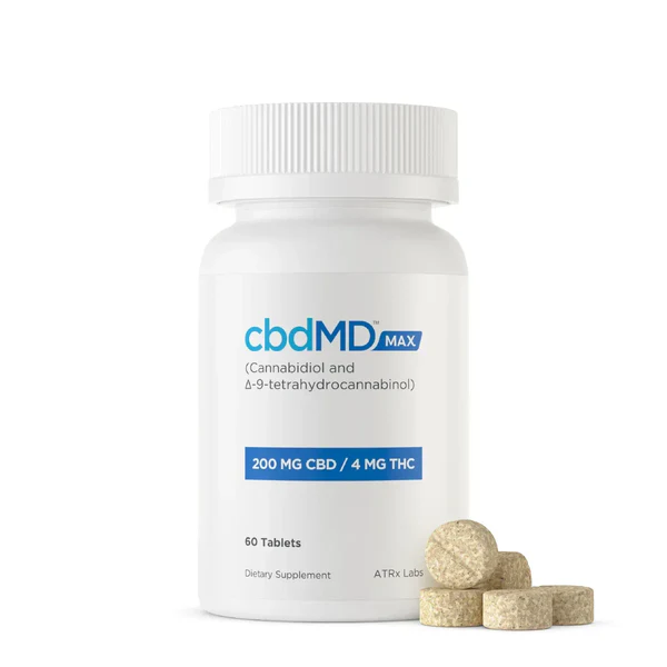 White bottle labeled cbdMD MAX 200mg CBD 4mg THC tablets with several beige tablets nearby